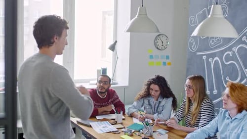 Team Meeting in Modern Open Office Space