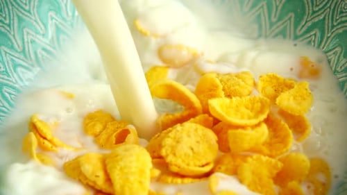 Pouring Milk into Cereal Bowl Close Up
