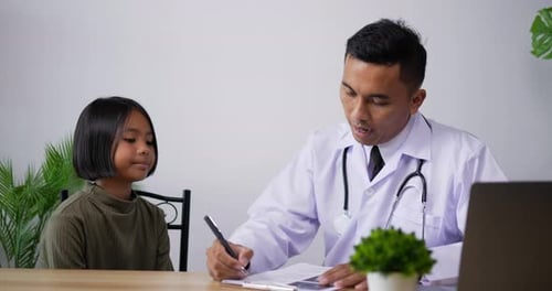 Doctor consulting patient girl in the clinic