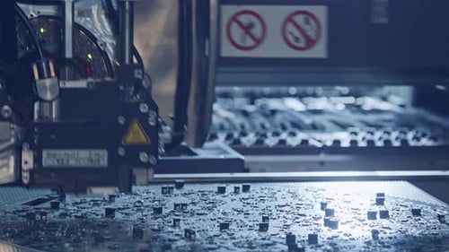 Surface Mount Technology SMT Machine places components on a circuit board