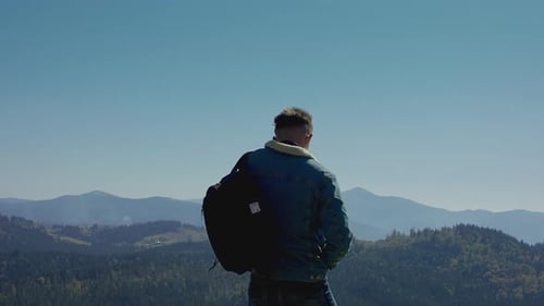 Young Man Looking At A Mountain Range.