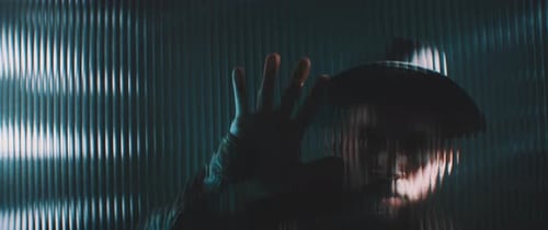 Man Behind Textured Glass with Hand