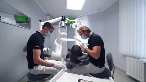 Dentist work with dental tools. Dentist working in modern stomatology clinic