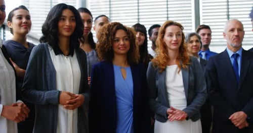 Diverse Business Team Clapping at a Corporate Event