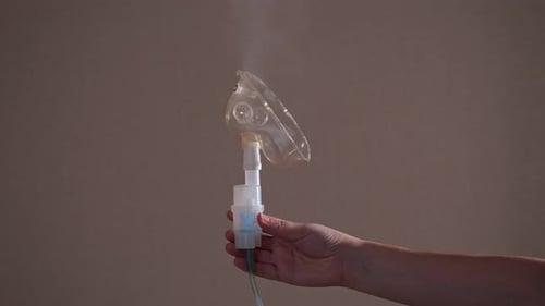 Nebulizer Mask Emitting Vapor Close Up