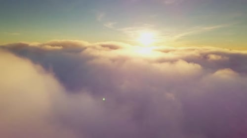 Aerial View of Clouds with Sun Shining Above