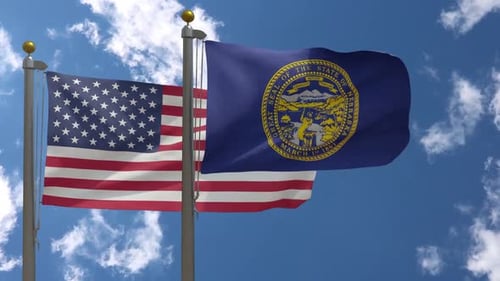 United States and Nebraska Flags Waving
