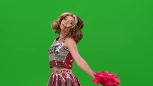 Young Cheerleader Dancing With Pom-poms on Green Screen