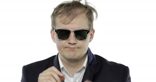 Man Puts on Sunglasses and Makes Ok Gesture