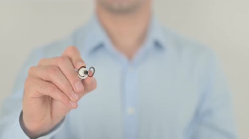 Hand Writes the Word Consumption on Glass