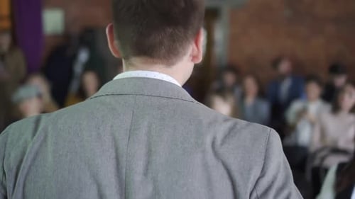 Coach Lecture. View of People in Conference Hall Listening the Information. Man Giving Presentation