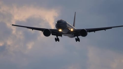 Silhouette of an Airplane in the Evening Sky