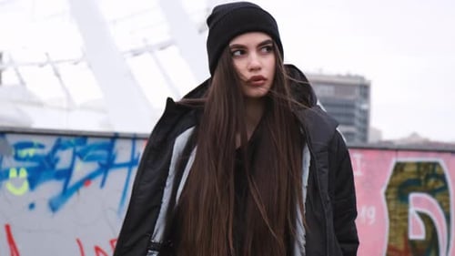 Stylish Woman in Black Jacket and Beanie