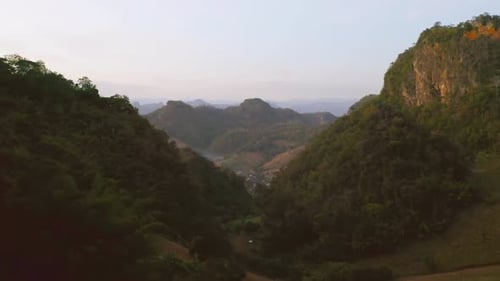 Aerial top view of forest trees and green mountain hills. Nature landscape background, Thailand.