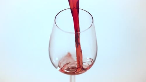 Red wine pouring in a glass