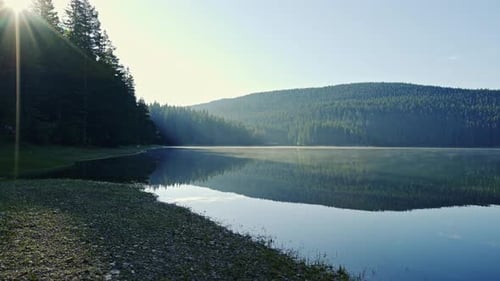 Bright Sun Over Calm Lake