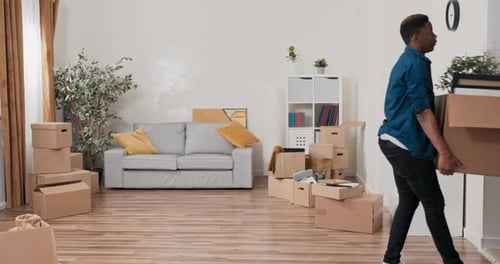 Couple Moving into New Home with Boxes