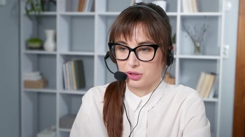 Woman Wearing Headset Talking in Office