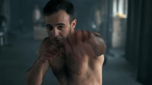 Man Boxing in Gym: Intense Training and Exercise