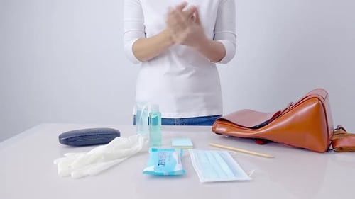 Woman Preparing Protective Items for a Day Out