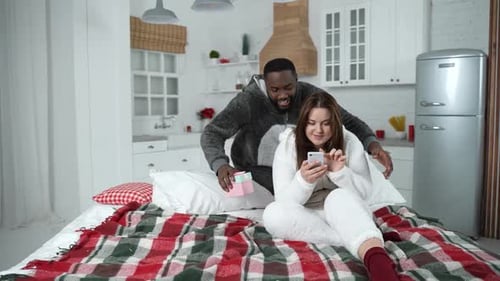 Happy Couple Celebrating a Birthday in Bed