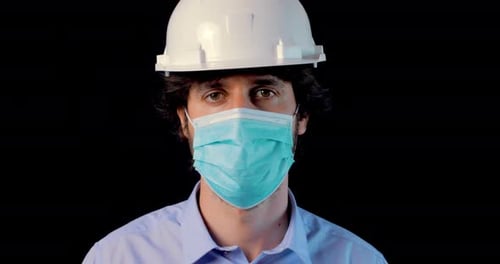 Person Wearing Hard Hat and Surgical Mask