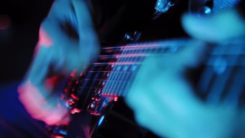 Close Up on Hands Playing on Electric Guitar