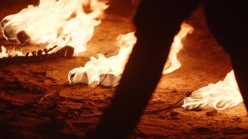 Fiery Ice Burning on Sandy Surface Close Up