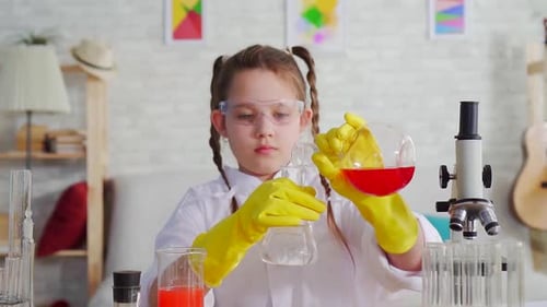 Enthusiastic Child Scientist Doing a Home Experiment