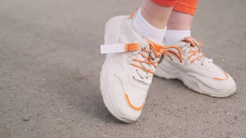 The concept of sports healthy lifestyle.Close-up. Outdoor leg exercises. Girl sports training. Beaut