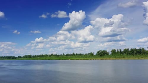 Landscape with Clouds Over River Timelapse