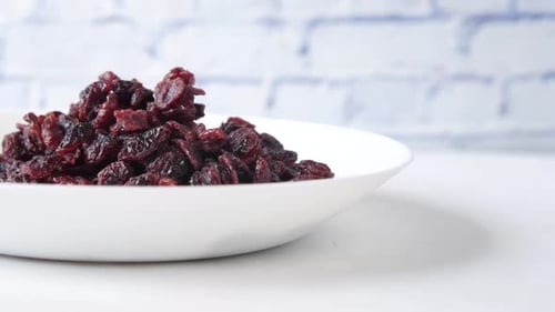 Dried Cranberries Piled in White Bowl