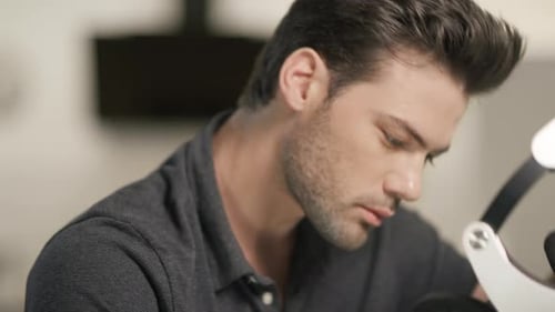 Man Puts On Virtual Reality Headset Indoors