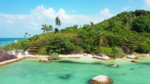 Paradise calm bay with turquoise lagoon washing limestone cliffs on shore of tropical island with pa