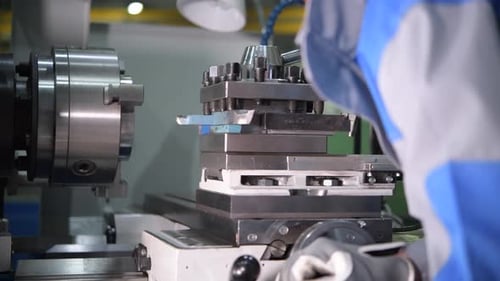 Man Operating Machinery in a Workshop