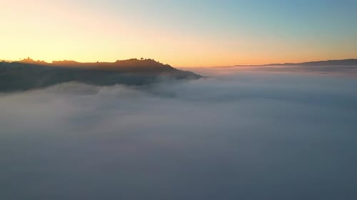 4K Aerial view of the misty sunrise in the forest. Tropical Rainforest in Thailand
