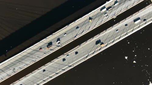 Cars Driving on a Modern Cable-stayed Bridge, Aerial View Vertically Down.
