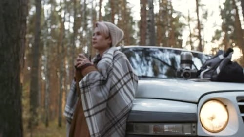 Woman Relaxing and Drinking Tea in Forest