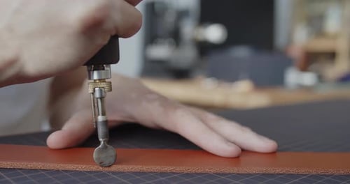 Using Electric Grooving Iron During Leather Belt Making Process