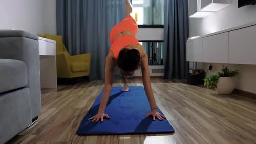 Woman Exercising on Yoga Mat in Her Apartment
