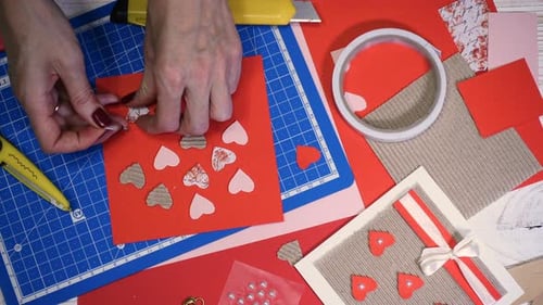 Hands Making Handmade Heart Card for Wedding