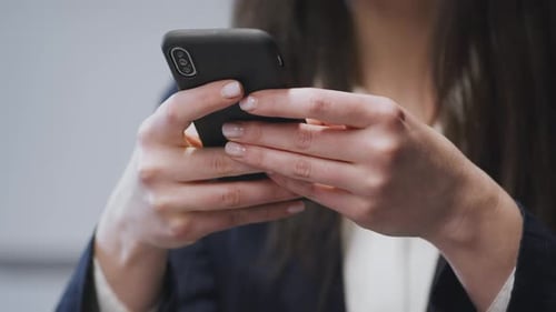 Woman Typing on Smartphone Close Up