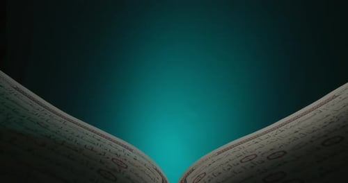 Open Book with Arabic Text and Beaded String