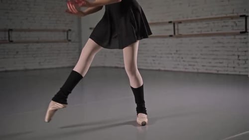 Elegant Ballerina Dancing in Studio