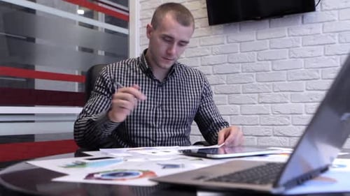 Businessman Working in Office and Write