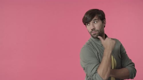 Confident Brunette Man Posing with Crossed Arms