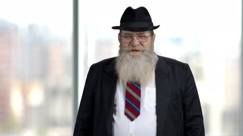 Man With Grey Beard in Suit and Hat