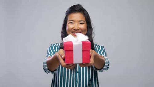 Smiling Woman Presents Birthday Gift Box