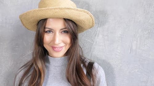 Smiling Woman Wearing Hat Looking at Camera