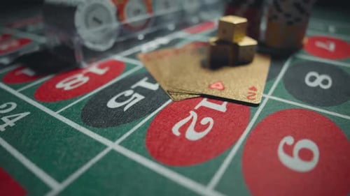 Casino Chips with Dice and Playing Cards on a Dark Table